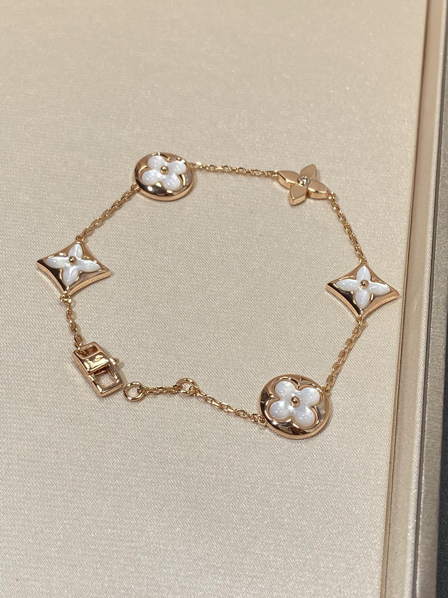 TimiSTAR AND SUN 5 MOTIF MOP PINK GOLD BRACELET